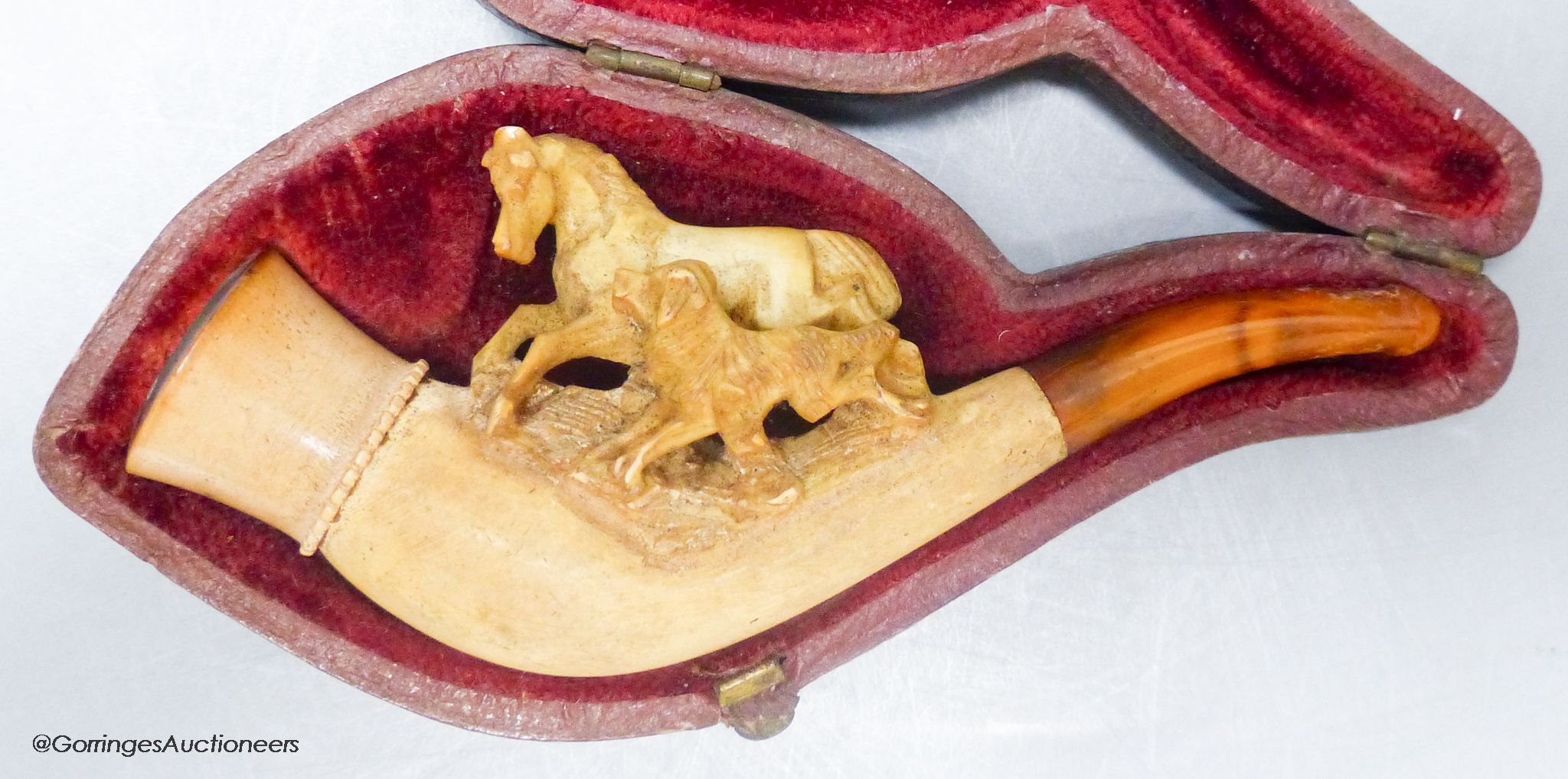 A cased meerschaum pipe